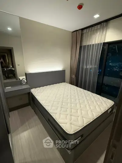 Modern bedroom with city view and elegant decor