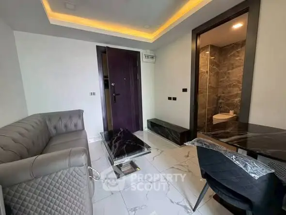 Modern living room with elegant marble flooring and stylish furniture