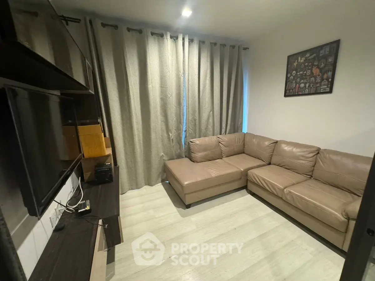 Cozy living room with modern sectional sofa and entertainment center
