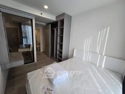 Modern bedroom with built-in closet and natural light