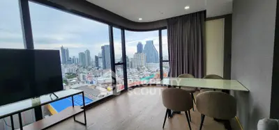 Stunning corner unit with panoramic city views and modern interior design.