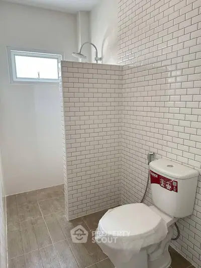 Modern bathroom with subway tiles and natural light