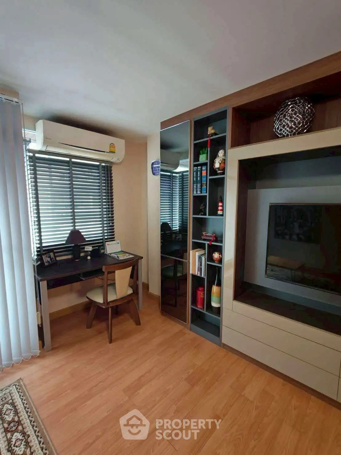 Modern study room with built-in shelves and air conditioning