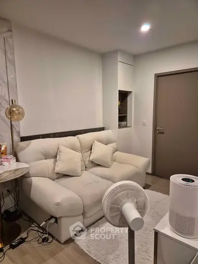 Cozy living room with plush sofa and modern decor