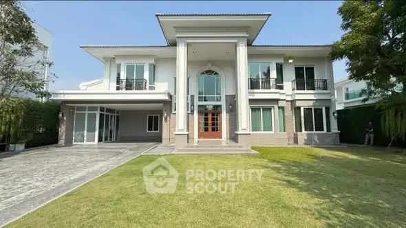 Stunning modern two-story house with spacious lawn and elegant entrance