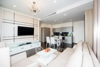 Luxurious open-plan living room with modern kitchen and elegant decor