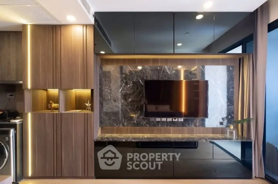 Luxurious modern living room with sleek wooden cabinetry and mounted TV, perfect for stylish urban living.