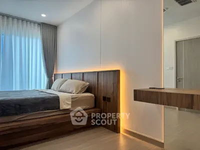 Modern bedroom with sleek wooden accents and ambient lighting