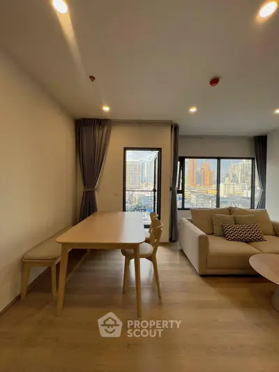 Modern living room with city view and stylish furniture