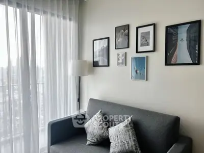 Stylish living room with modern decor and city view balcony