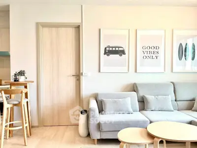 Modern living room with stylish decor and cozy seating area, perfect for relaxation and entertaining.