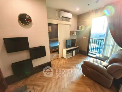 Modern living room with cozy seating and balcony view