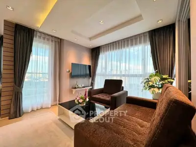 Modern living room with large windows and stylish furniture