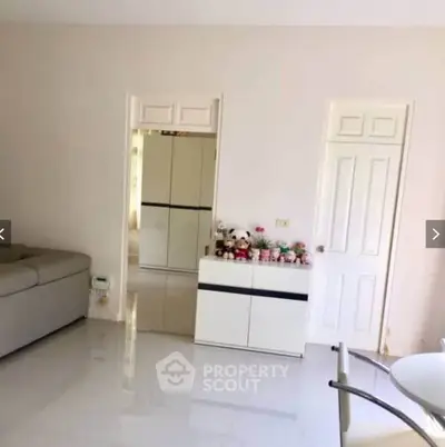 Spacious living room with modern decor and plush sofa