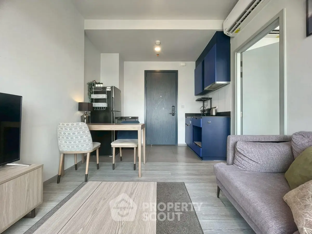 Modern living room with open kitchen and stylish decor in a cozy apartment