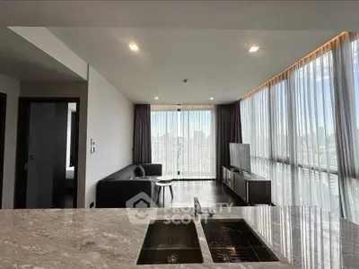 Modern living room with panoramic city view and sleek marble countertop