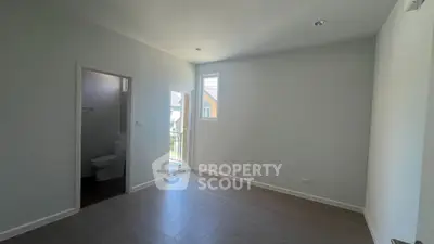 Bright unfurnished room with balcony access and modern design, perfect for customization.