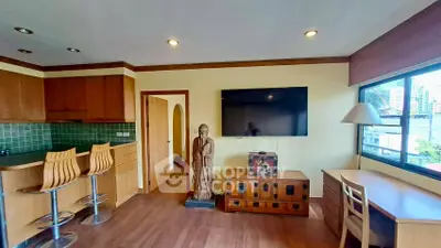 Charming living room with modern kitchen, large TV, and city view window