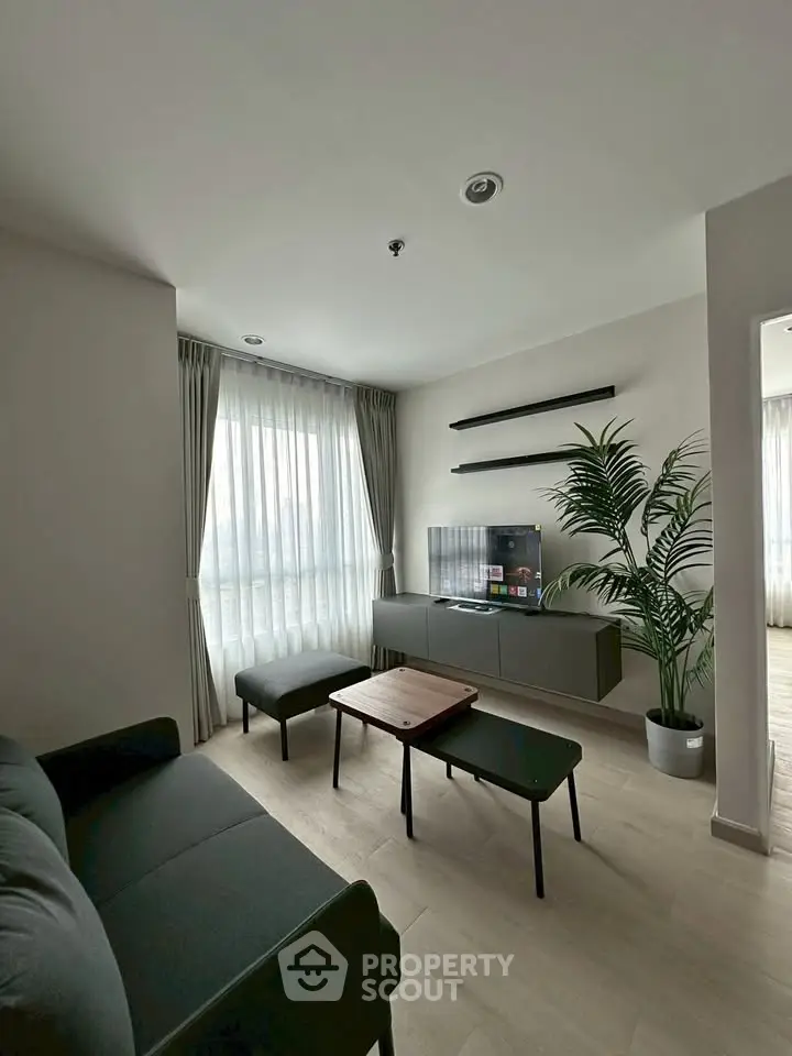 Modern living room with sleek furniture and natural light