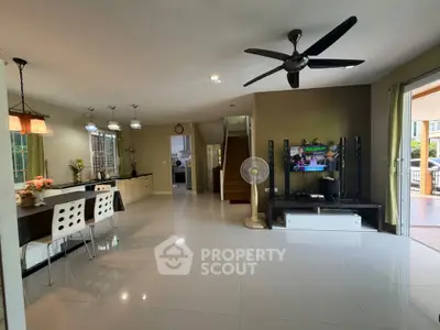 Spacious open-plan living room with modern kitchen and stylish decor