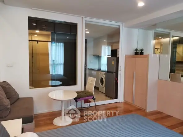 Modern living room with washing machine and stylish decor