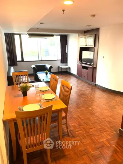 Spacious living room with dining area and modern furnishings