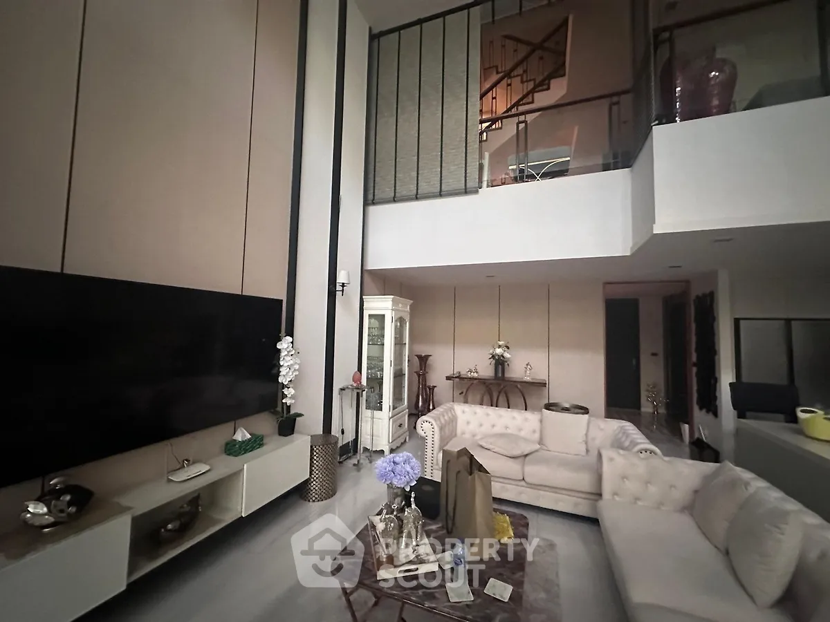 Luxurious modern living room with high ceilings and elegant decor