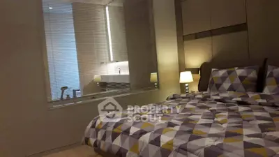 Modern bedroom with geometric bedding and ambient lighting