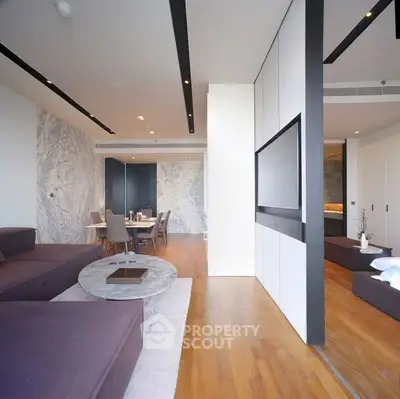 Luxurious modern living room with open layout and elegant dining area