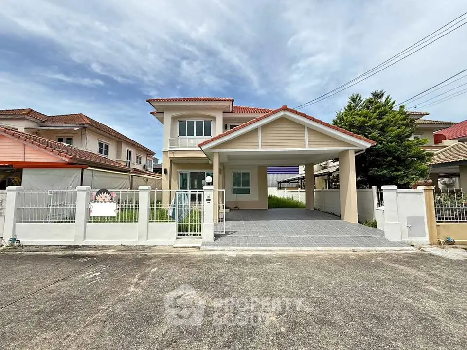 Charming suburban house with spacious driveway and modern architecture.