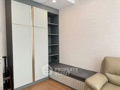 Modern living room with sleek storage and comfortable seating