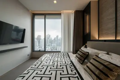 Luxurious bedroom with city view and modern decor