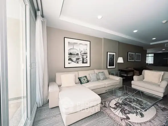 Stylish living room with modern furniture and large windows for natural light.