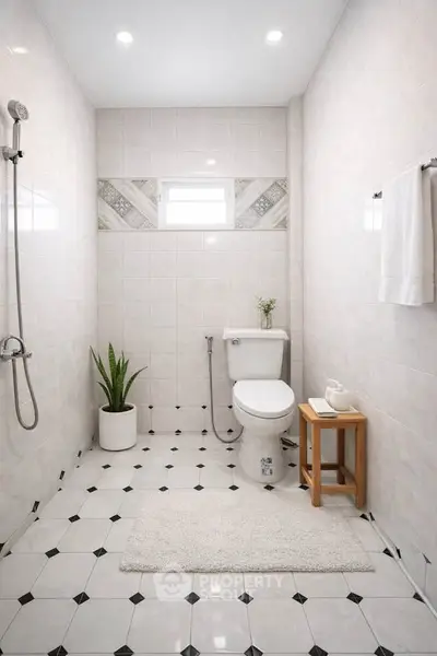 Elegant minimalist bathroom with modern fixtures and stylish tile design.
