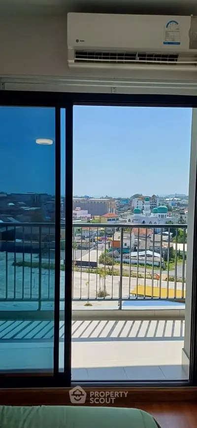 Spacious balcony with stunning city view from modern apartment