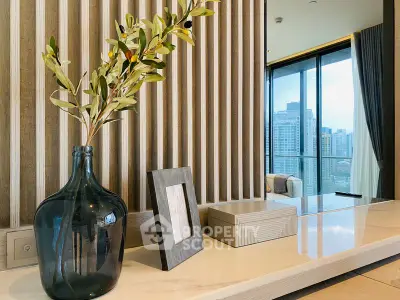 Modern living room with elegant decor and city view from large windows.