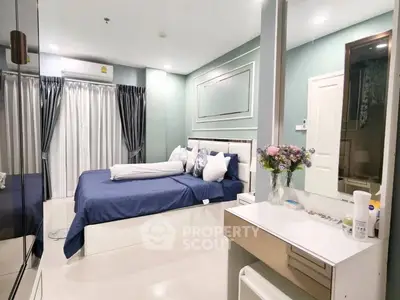 Luxurious bedroom with elegant decor and modern furnishings, featuring a cozy bed and stylish vanity.