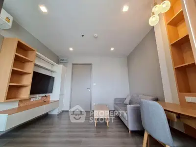 Modern living room with sleek furniture and built-in TV unit