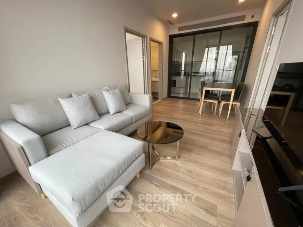 Modern living room with sleek furniture and open layout in stylish apartment