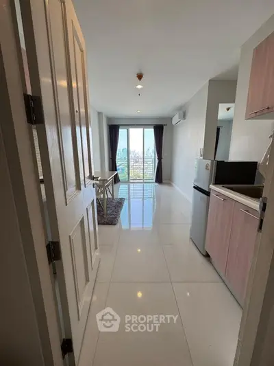 Modern apartment with stunning city view, open layout kitchen, and sleek design.