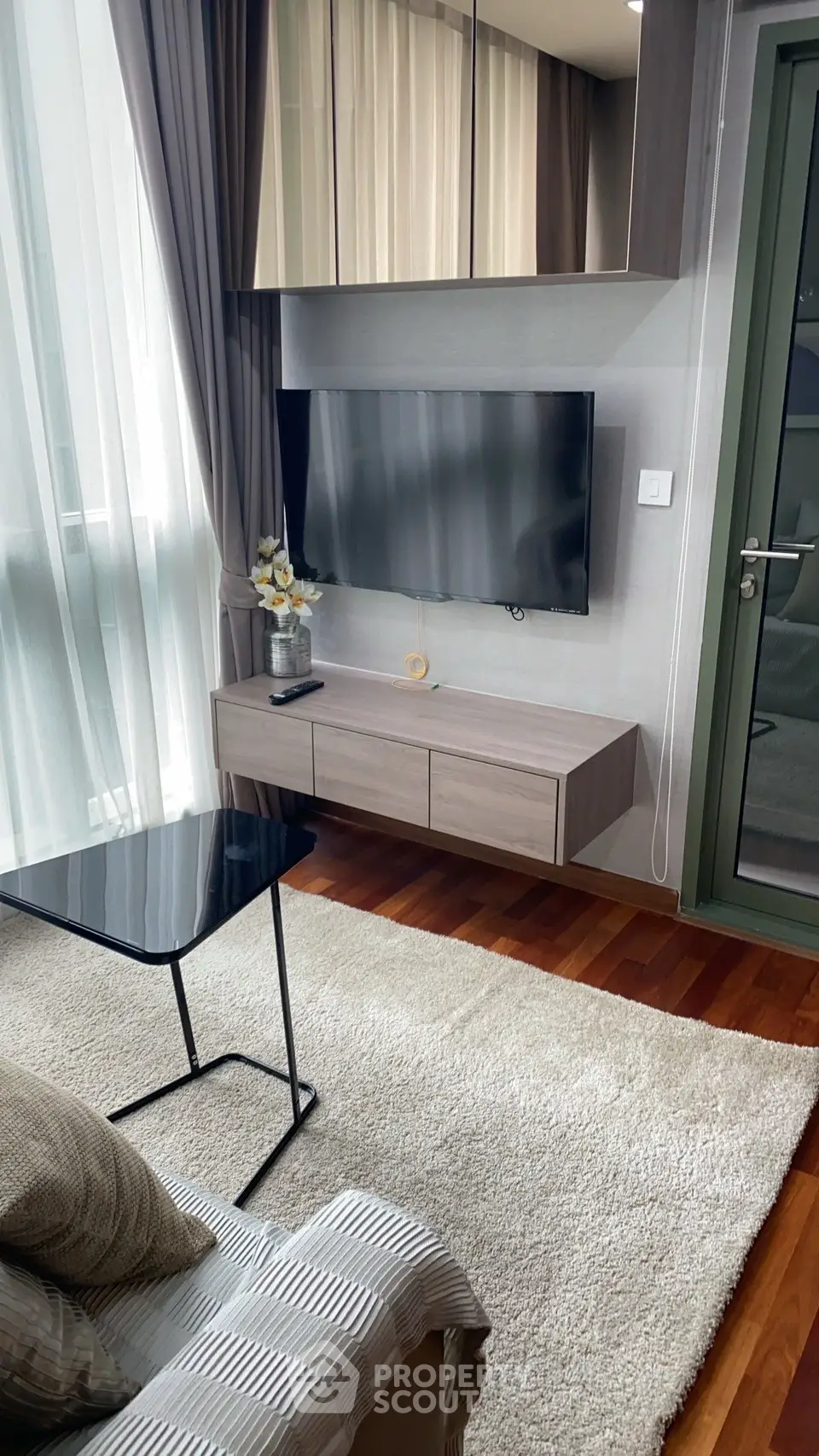 Modern living room with sleek TV setup and elegant decor