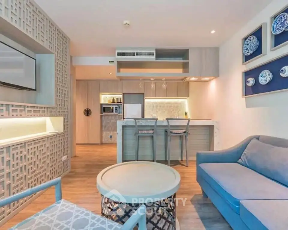 Modern living room with open kitchen and stylish decor