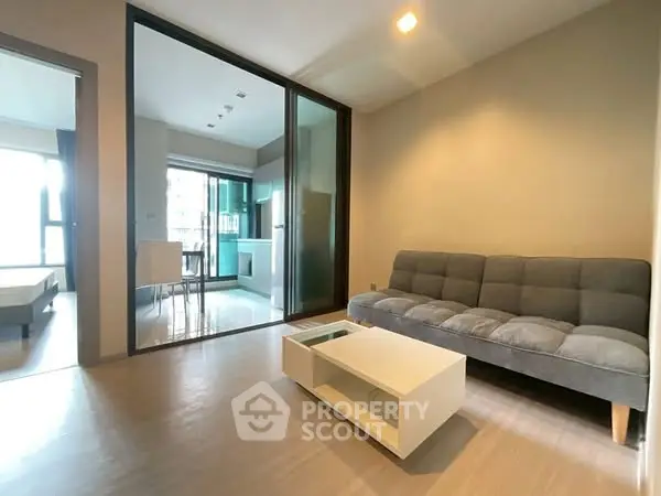 Modern living room with sleek furniture and open layout in contemporary apartment.