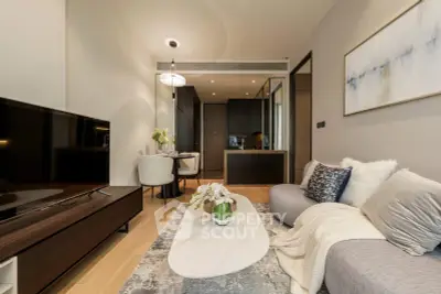 Modern living room with elegant decor and open kitchen layout in a stylish apartment.