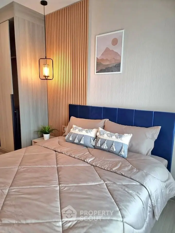 Modern bedroom with stylish decor and cozy bedding