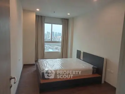 Modern bedroom with city view and stylish furnishings