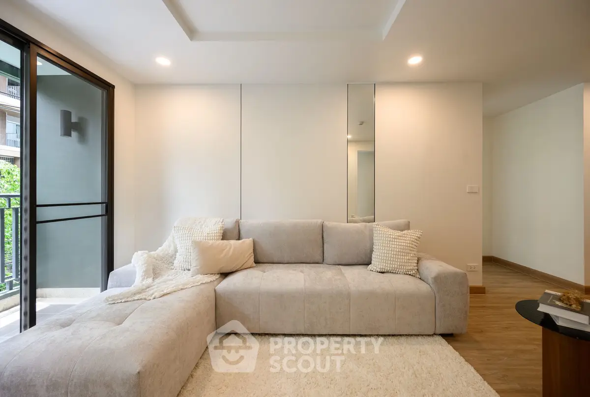 Modern living room with cozy sectional sofa and elegant decor in a bright apartment.