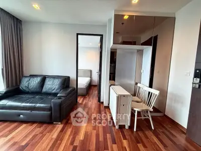 Modern living room with wooden flooring and stylish furniture