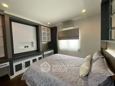 Modern bedroom with stylish built-in storage and cozy ambiance