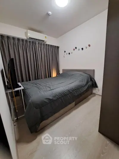 Cozy bedroom with modern decor and ample natural light